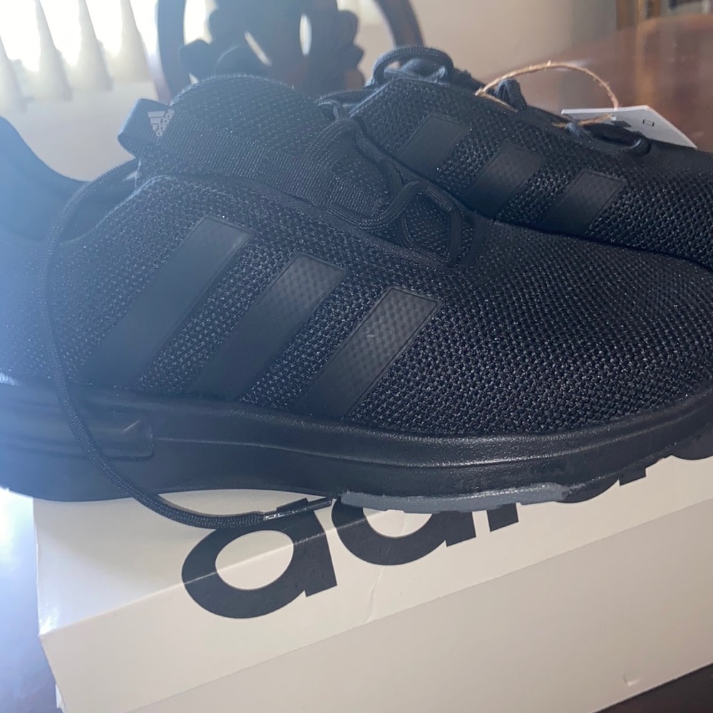 Black adidas running shoes